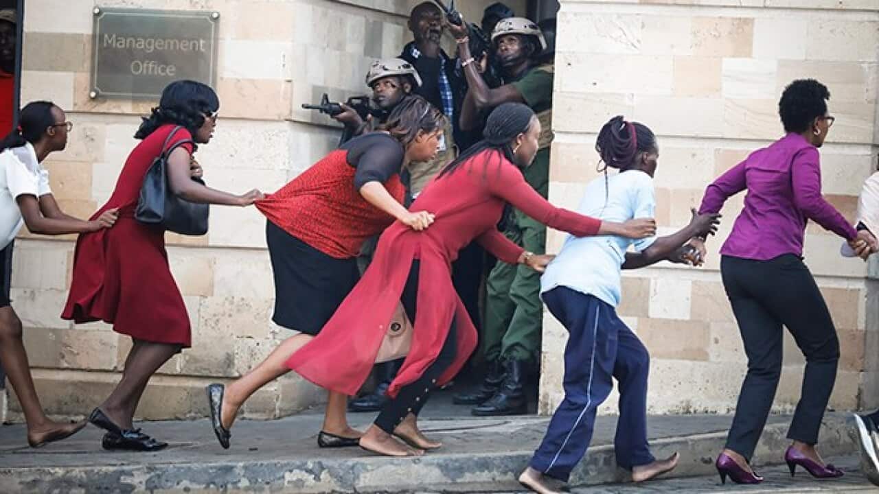 People flee the hotel targeted in Nairobi