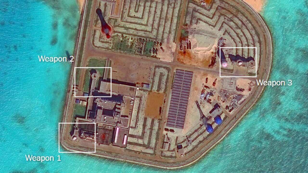 Weapons systems are visible on Chinese outposts on Johnson Reef in the South China Sea.