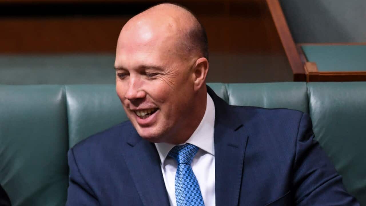 Home Affairs Minister Peter Dutton laughing during question time