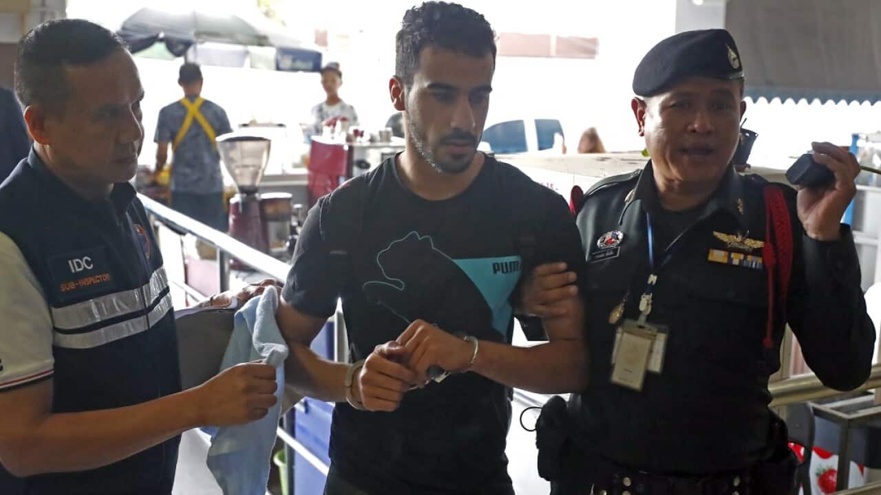 Hakeem AlAraibi is escorted into the Criminal Court by authorities in Bangkok on Tuesday. 