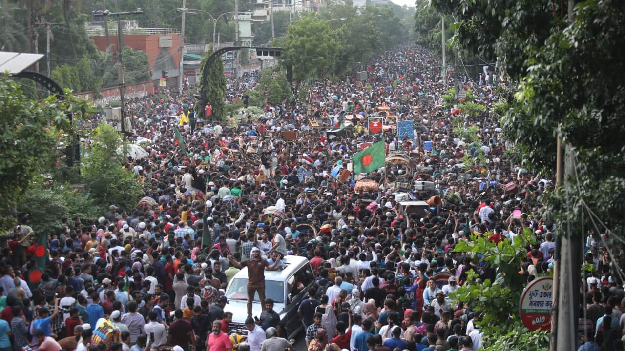 Bangladeshi people in Dhaka celebrate after the PM resigned (AAP)
