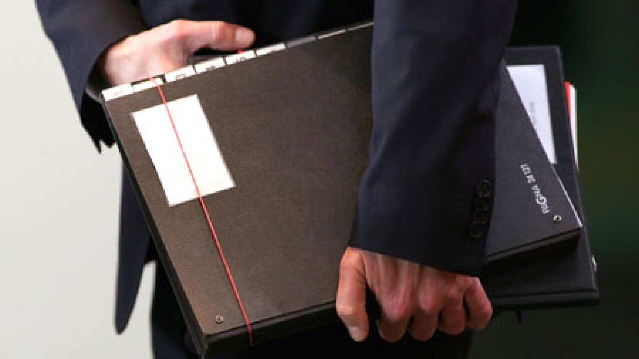 businessman_holding_files_090821_B_getty_1683942117