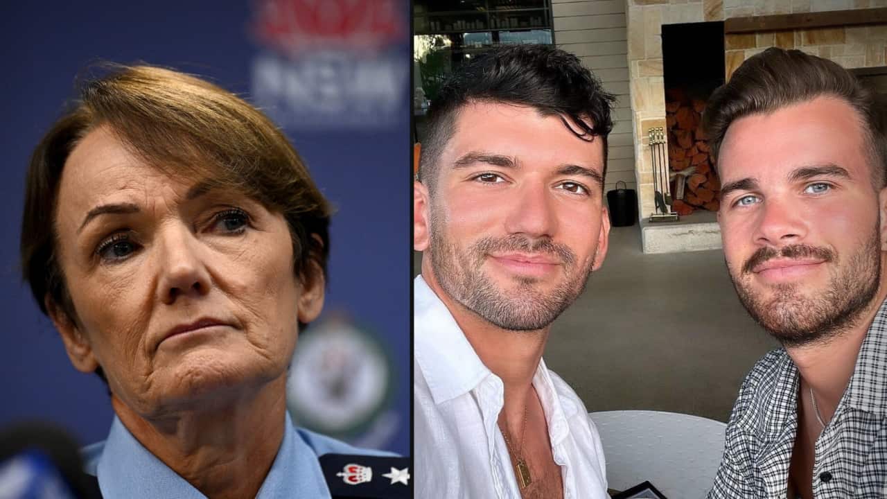 A woman to the left, and a male couple to the right