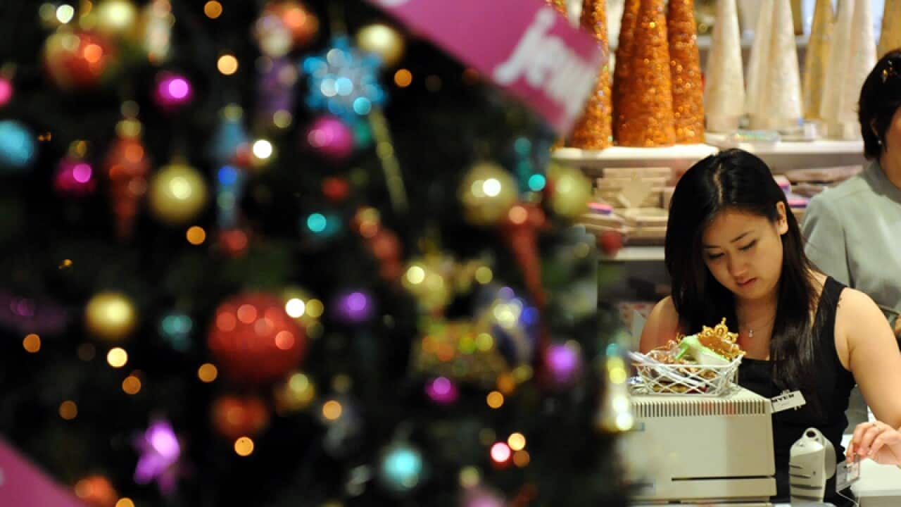 A Myer employee swipes an electronic card
