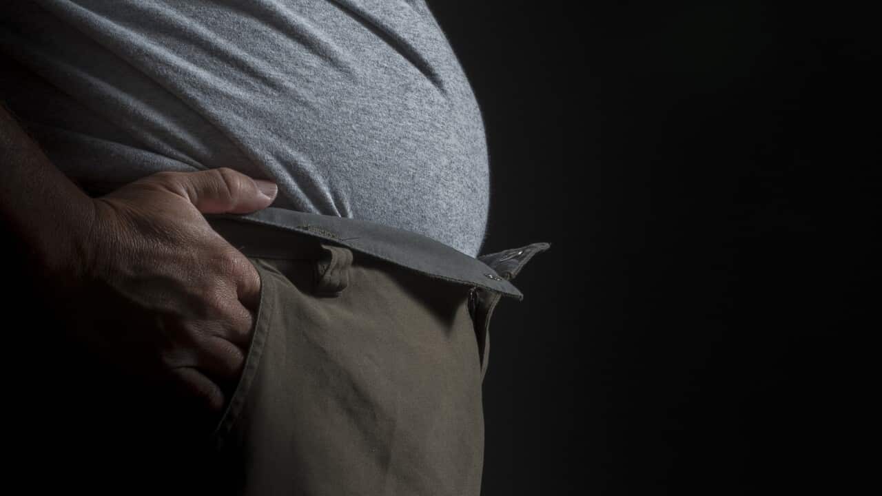 A man with a large waistline, Wednesday, Aug. 1, 2012. (AAP Image/John Pryke) NO ARCHIVING
