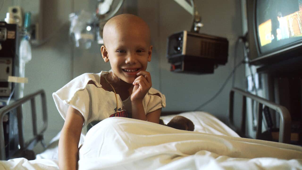 Young girl receiving chemotherapy