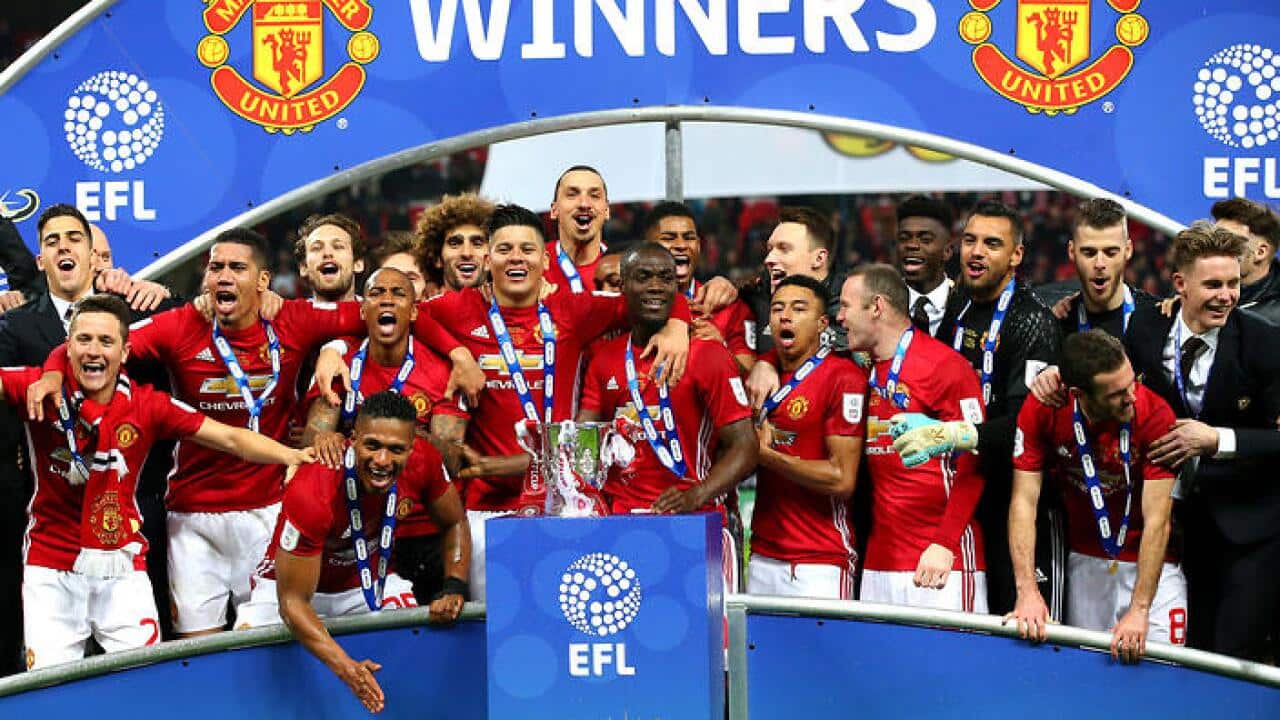 Manchester United players celebrate their EFL Cup final success