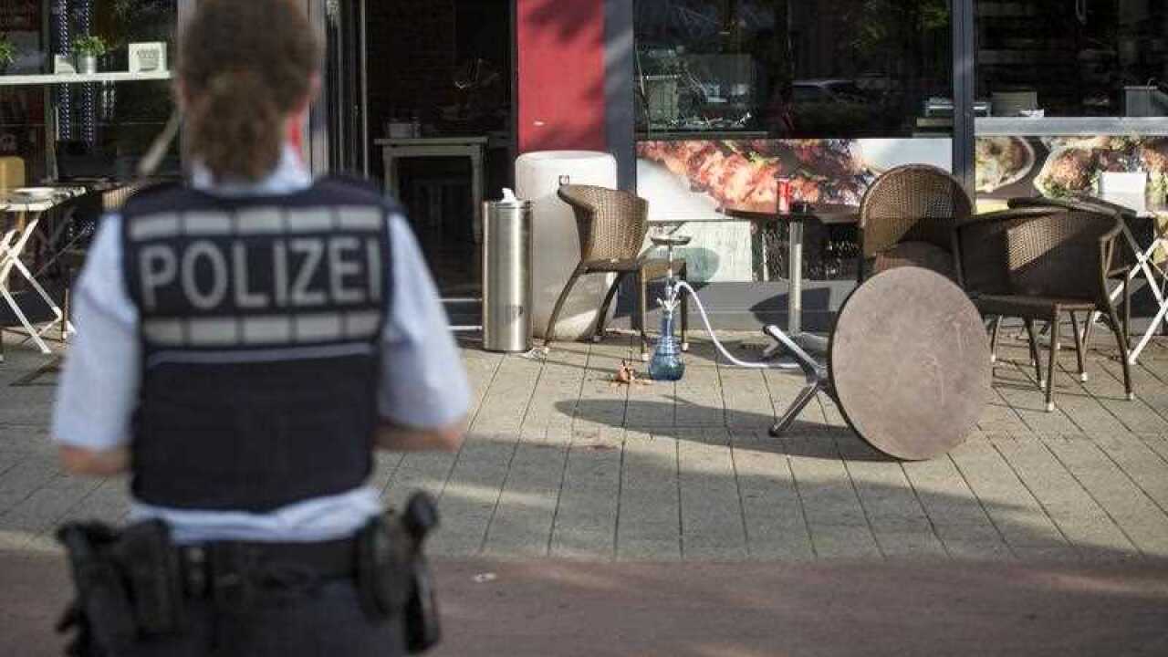 A policewoman in front of a cafe in Reutlingen, Germany