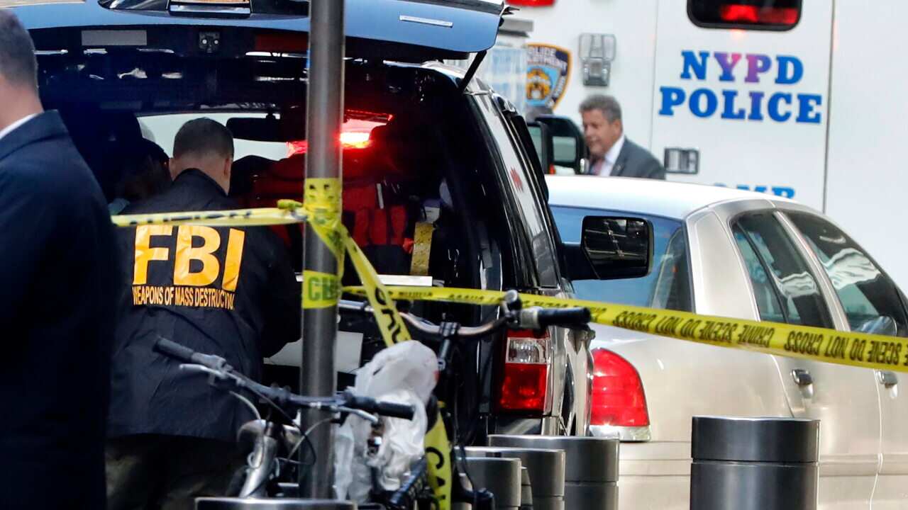 A member of the FBI Weapons of Mass Destruction team works outside the Time Warner Center, in New York. (AP)