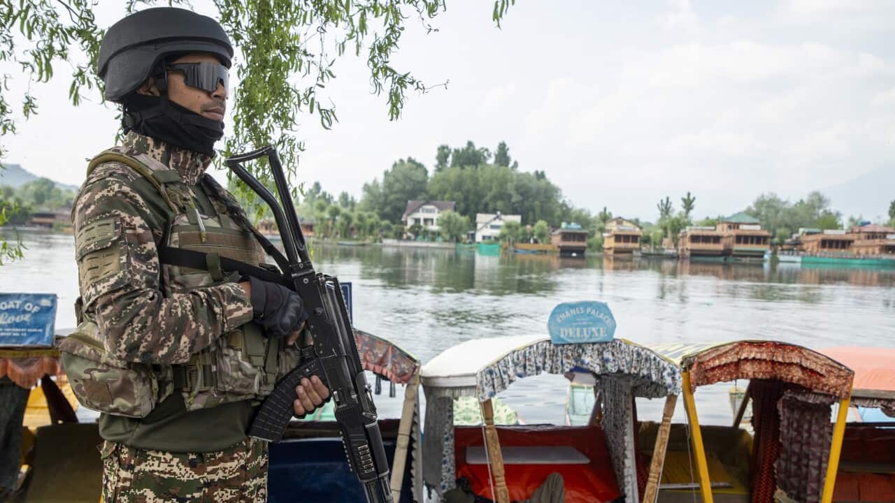 Indian paramilitary soldier stands alert in Srinagar.