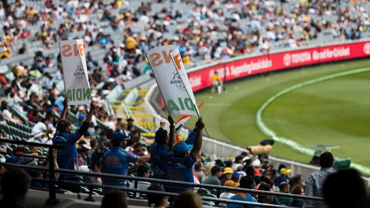 Fans flying flags and cheering during day two of the Test cricket match between Australia and India at the Melbourne Cricket Ground, 27 December, 2020