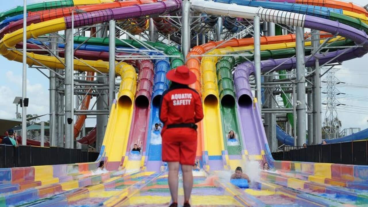 File image of an aquatic safety officer watching a water slide.