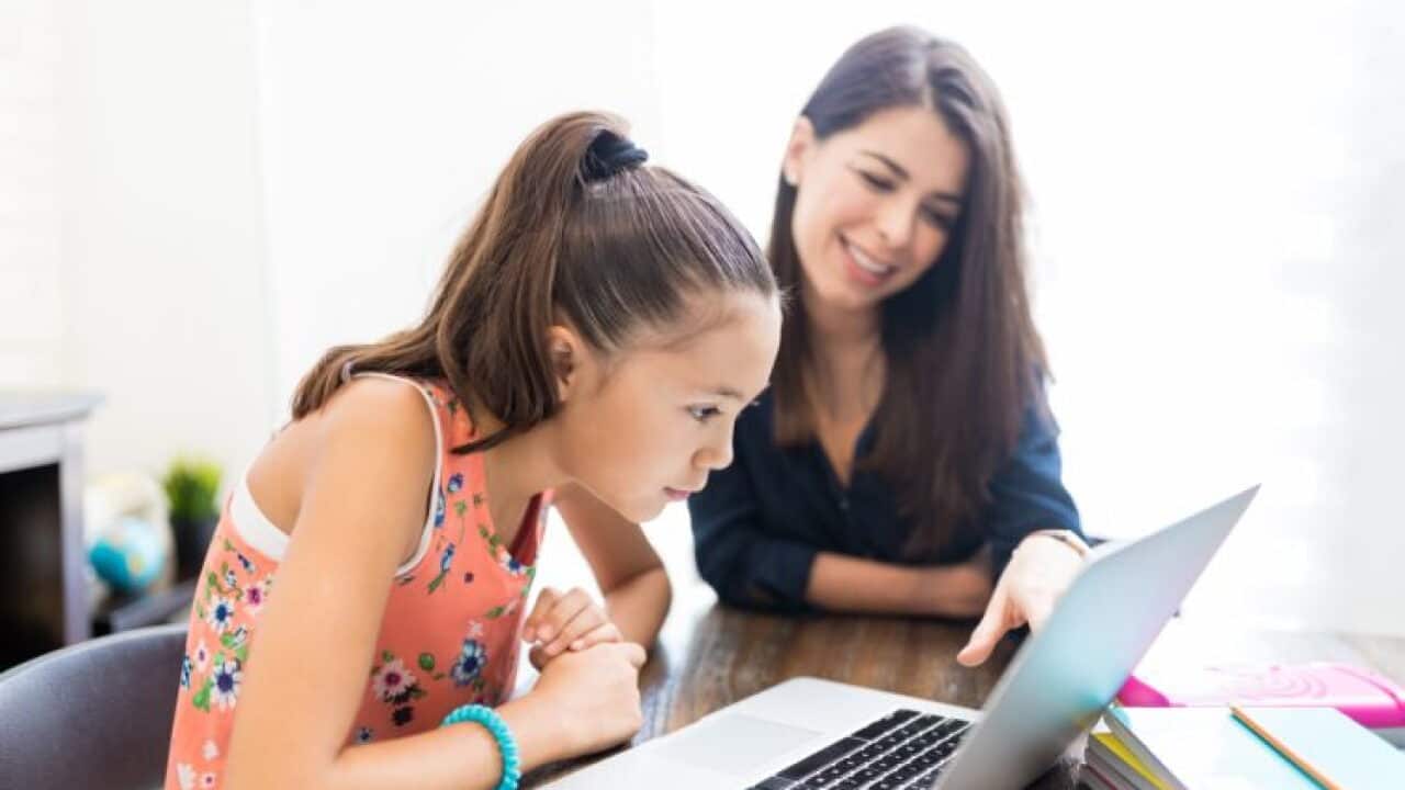 Girl And Teacher Using Laptop At Table