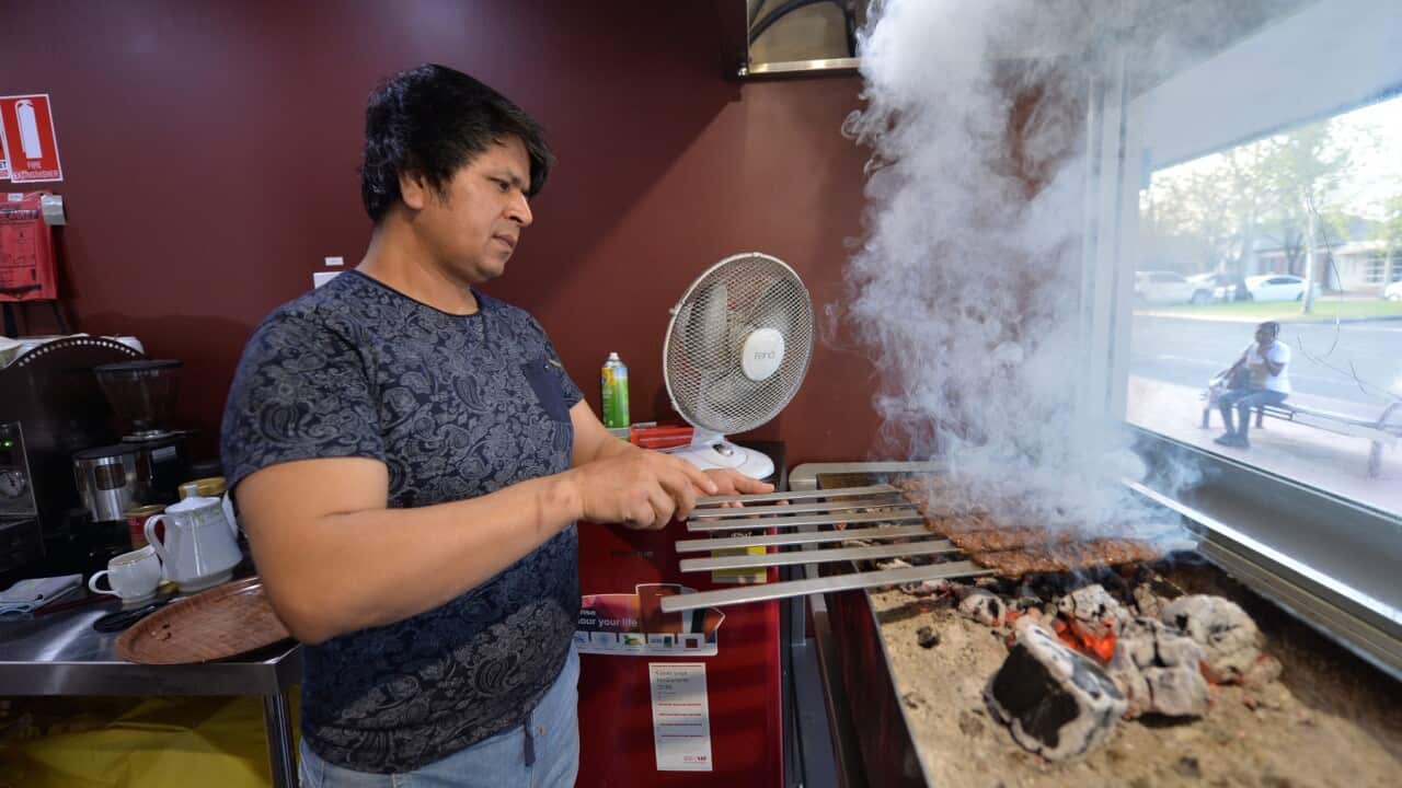 Hazara refugee Ali cooking kebabs in his "Afghan Friendship Restaurant" in Griffith