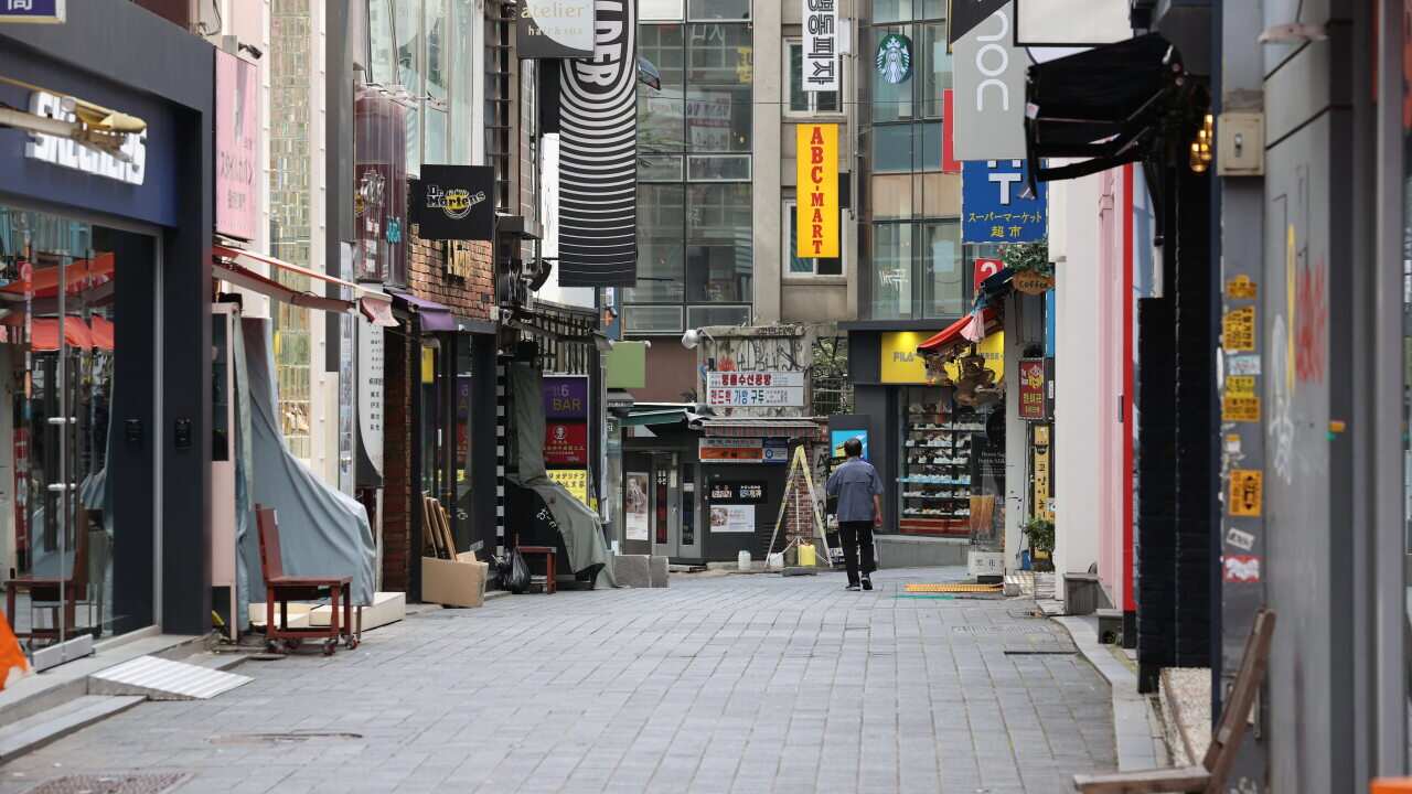 A view of the empty tourist hot spot of Myeongdong, after the government strengthened the social distancing level amid spiking COVID-19 cases, in Seoul