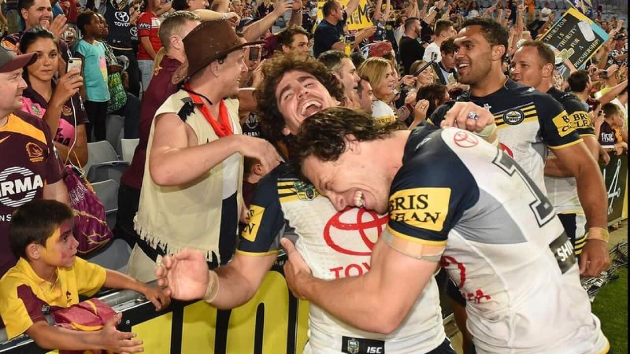 The Cowboys celebrate with fans.