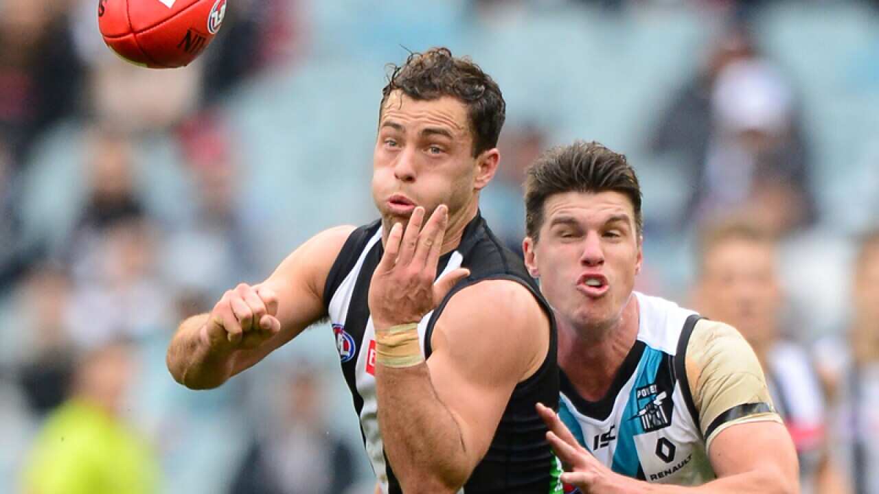 Collingwood's Jarryd Blair (L) and Port Adelaide's Paul Stewart