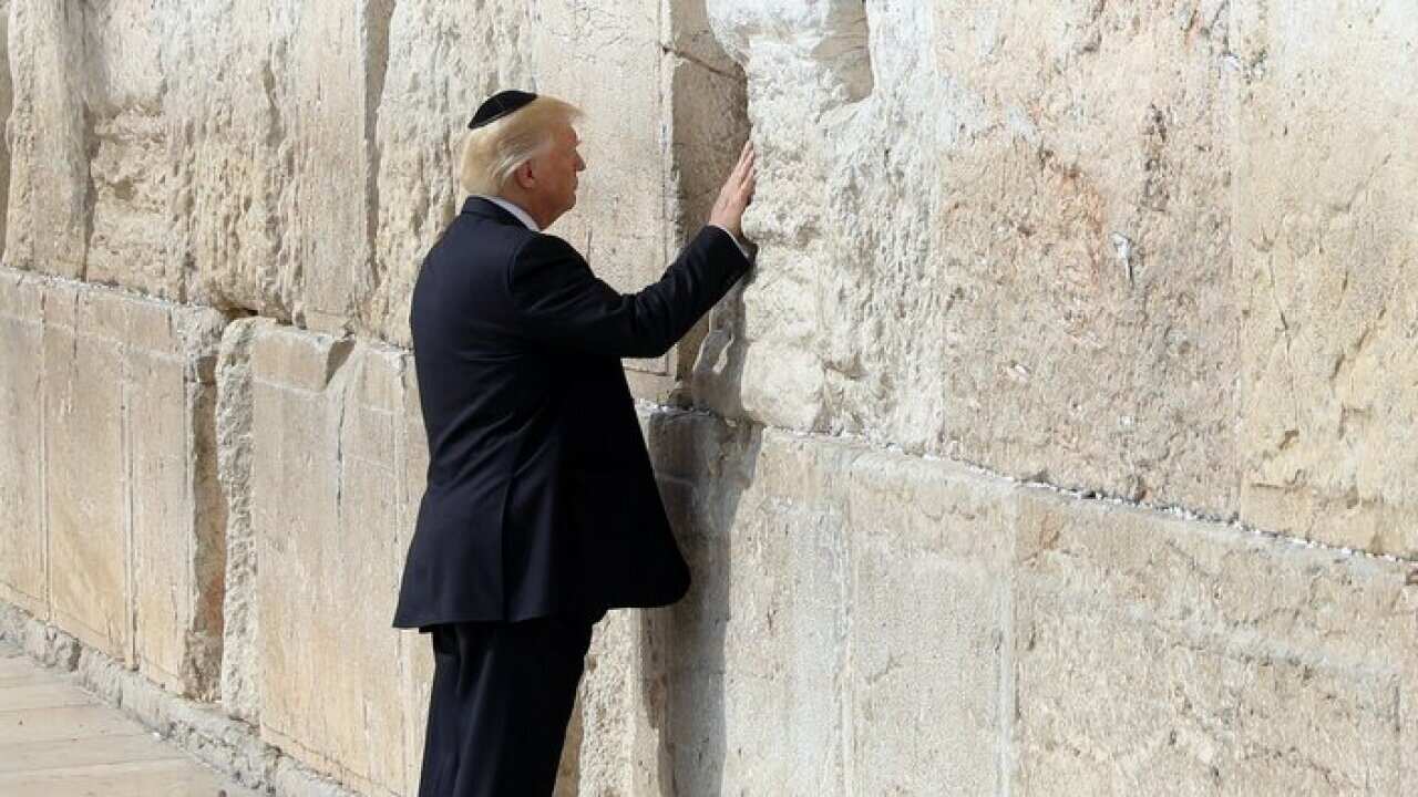 President Donald Trump touches the Western Wall,