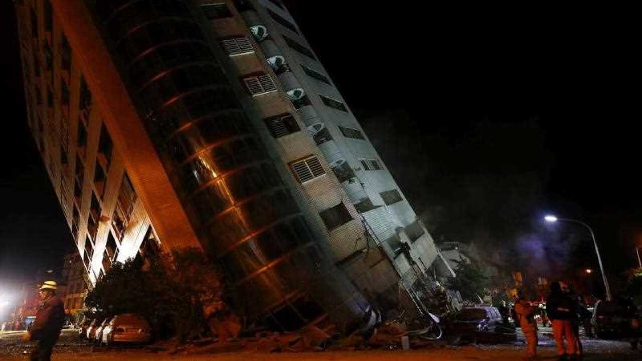 Rescue services search for people in a damaged building in Hualien, eastern Taiwan, 07 February 2018, after a magnitude 6 earthquake hit Hualien on the night of 06 February 2018.