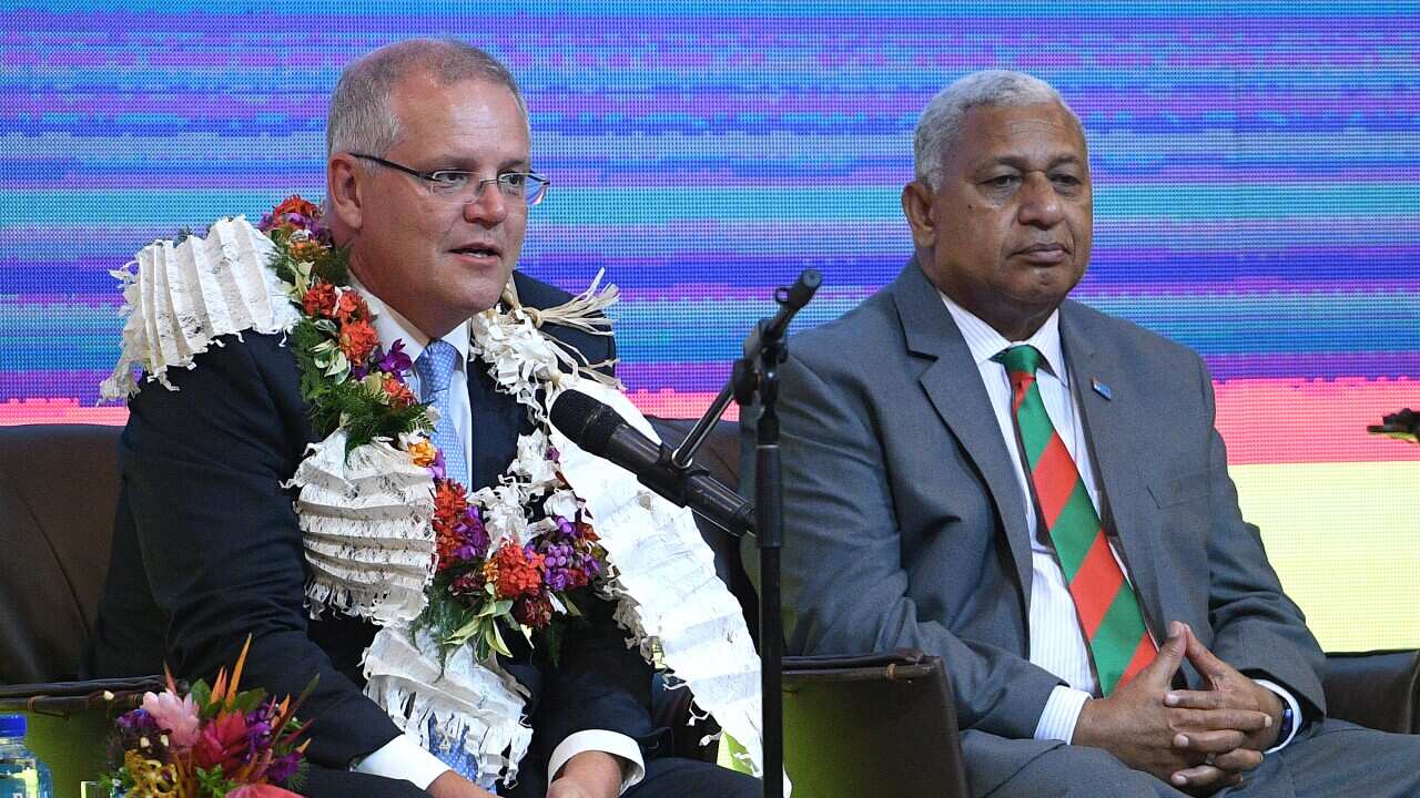 Prime Minister Scott Morrison (left) sits with Fiji Prime Minister Frank Bainimarama (right). The government hopes to strengthen ties with Fiji.