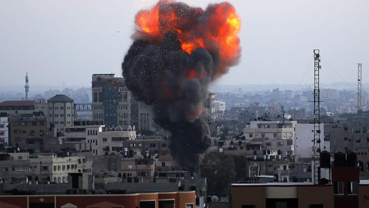 Smoke rises after Israeli air strikes in Gaza City