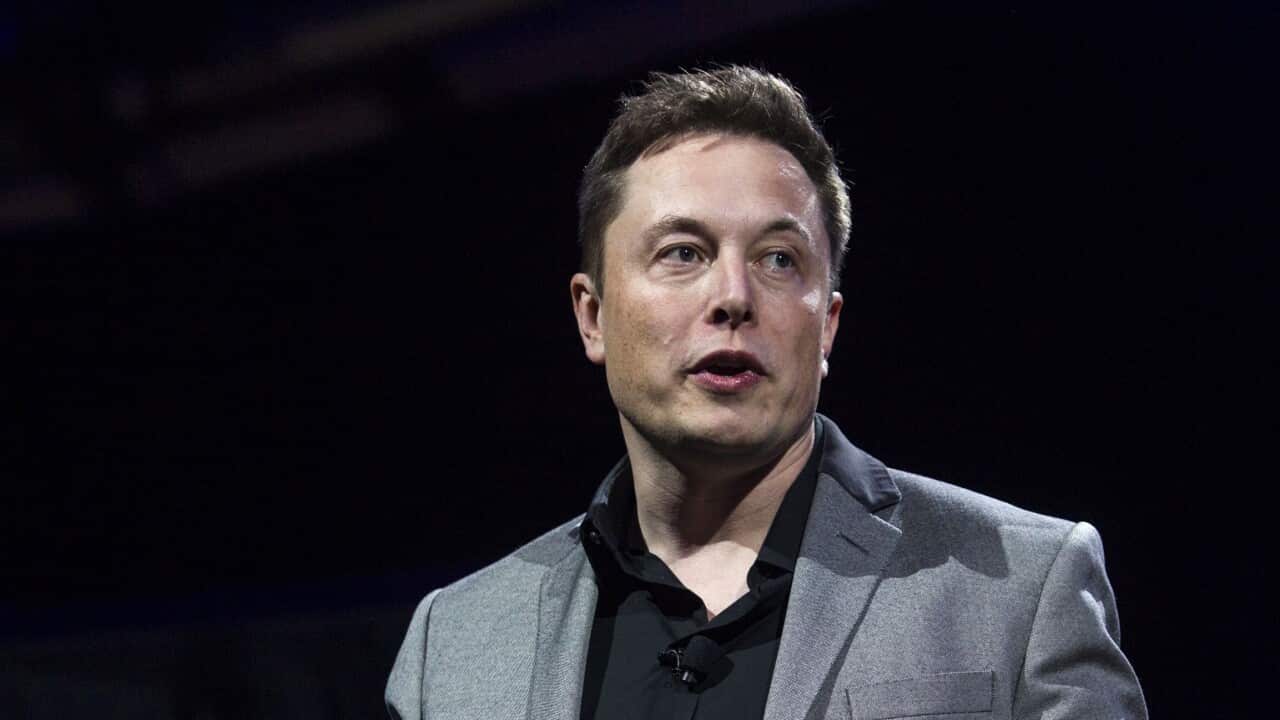 Man speaking on a stage