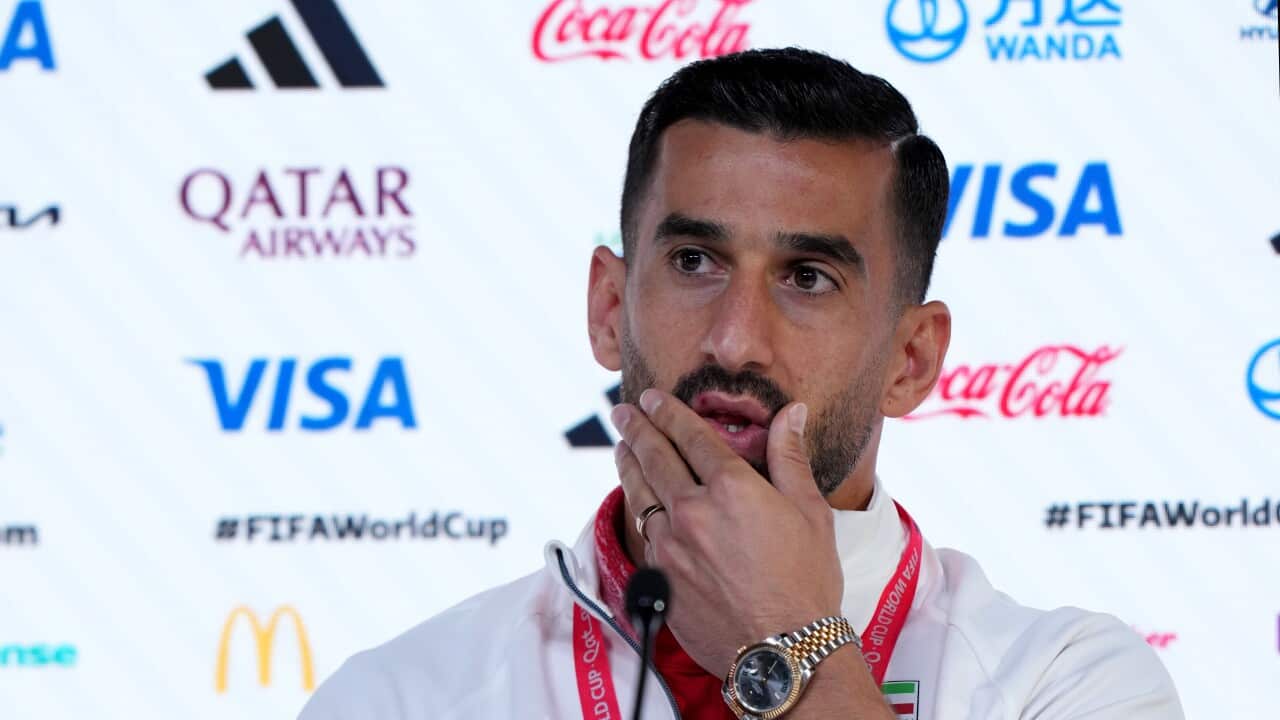 Ehsan Hajsafi speaking at a press conference