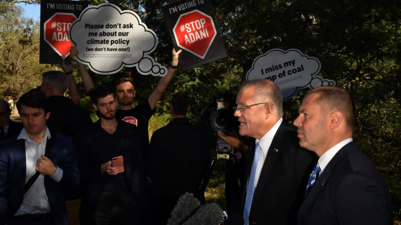 Prime Minister Scott Morrison Treasurer and Josh Frydenberg with anti-Adani protesters at a press conference at Studley Park in Kew, Melbourne,