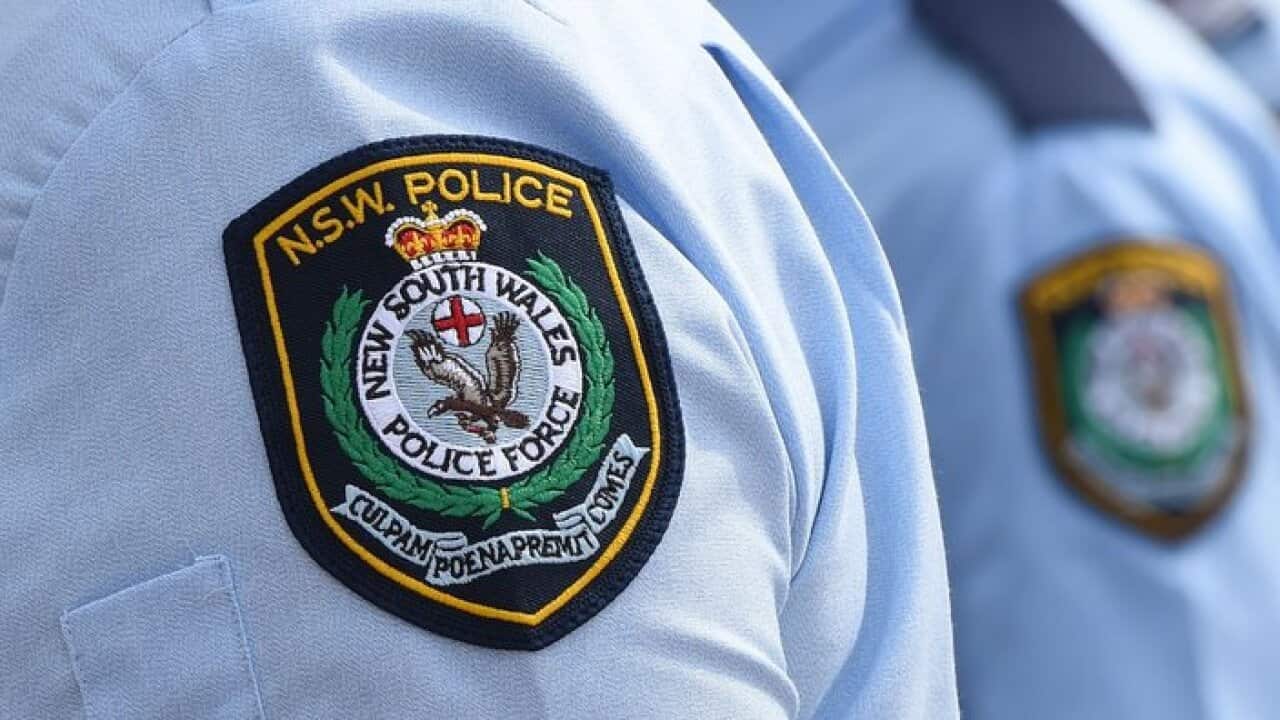 Stock image of New South Wales Police badges in Sydney, Friday, Aug. 16, 2013. (AAP Image/Dean Lewins) NO ARCHIVING