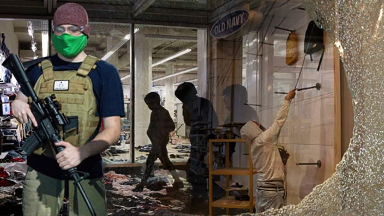 This doctored image showed a man holding a rifle in front of a store with broken windows.