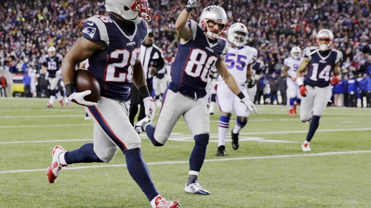 New England running back James White scores a touchdown