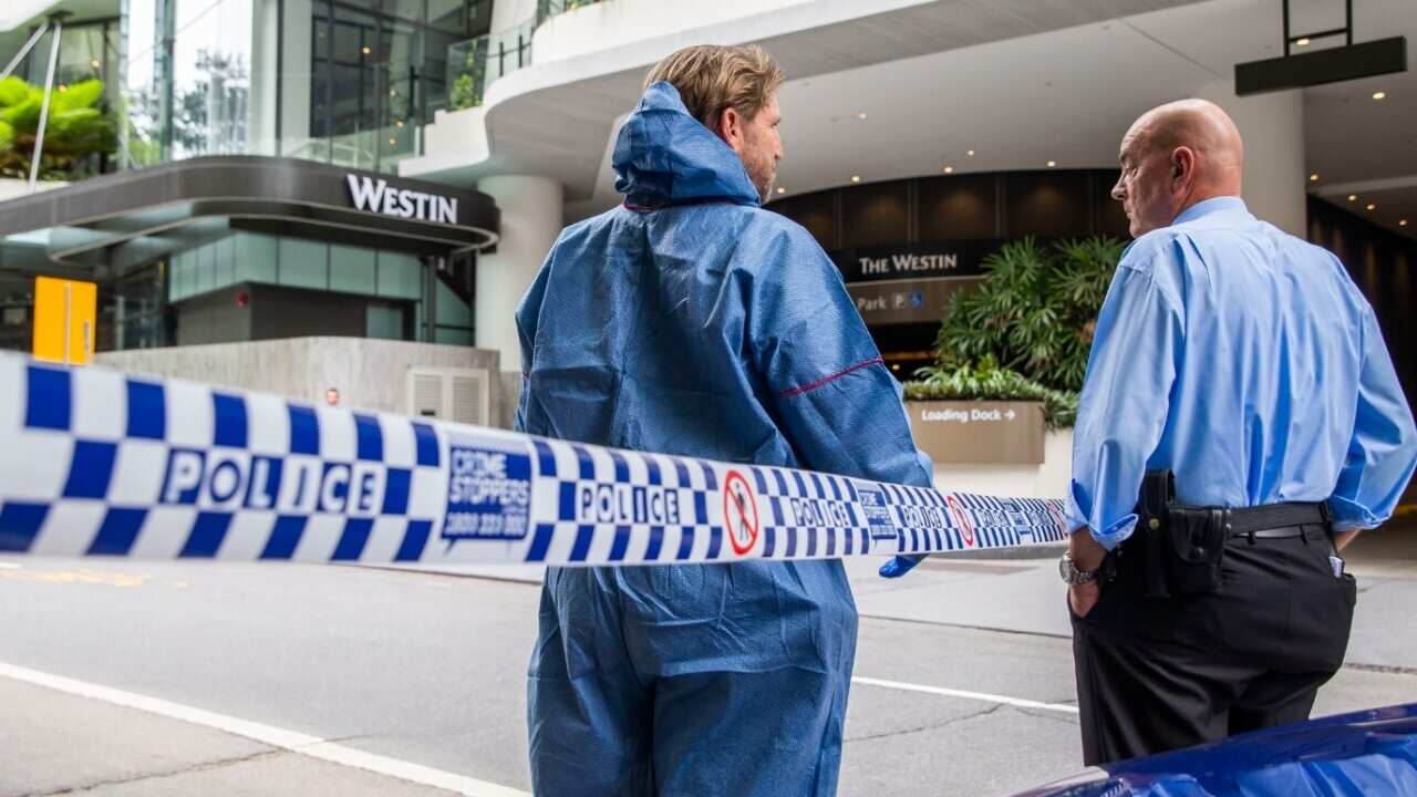 The forensic scene where police shot and killed a man outside the Westin Hotel on Mary Street in central Brisbane, Sunday, February 23, 2020.