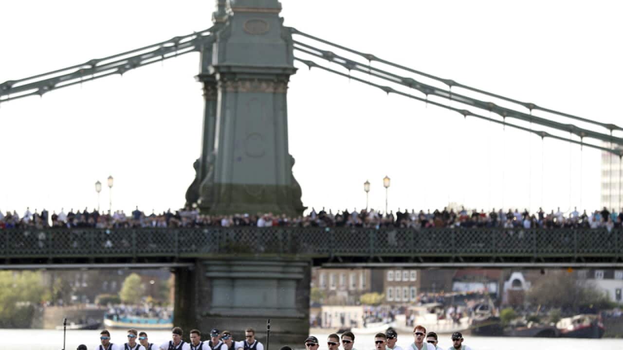 Oxford Men's crew, left, take the lead against Cambridge