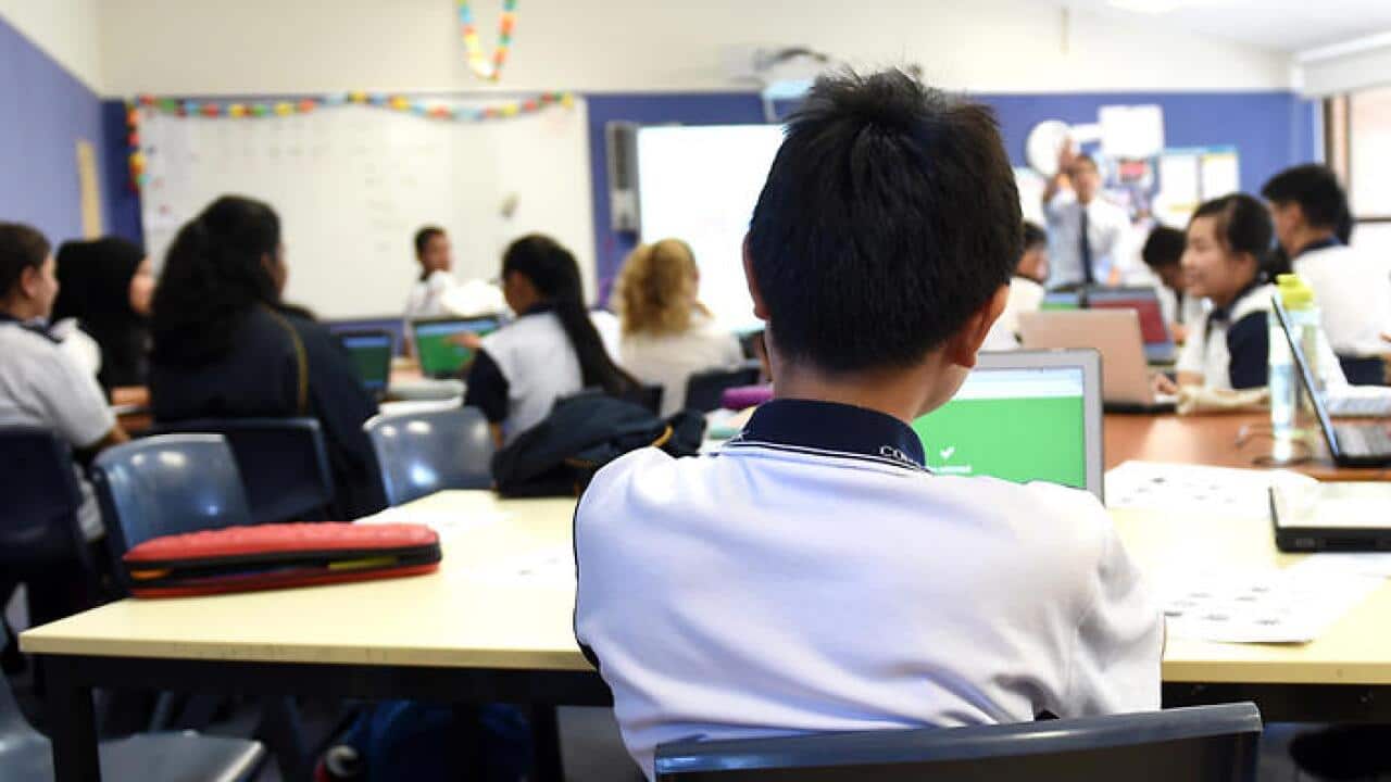 Students attend a class at Alexandria Park Community School in Sydney on Wednesday, May 4, 2016. (AAP Image/Paul Miller) NO ARCHIVING