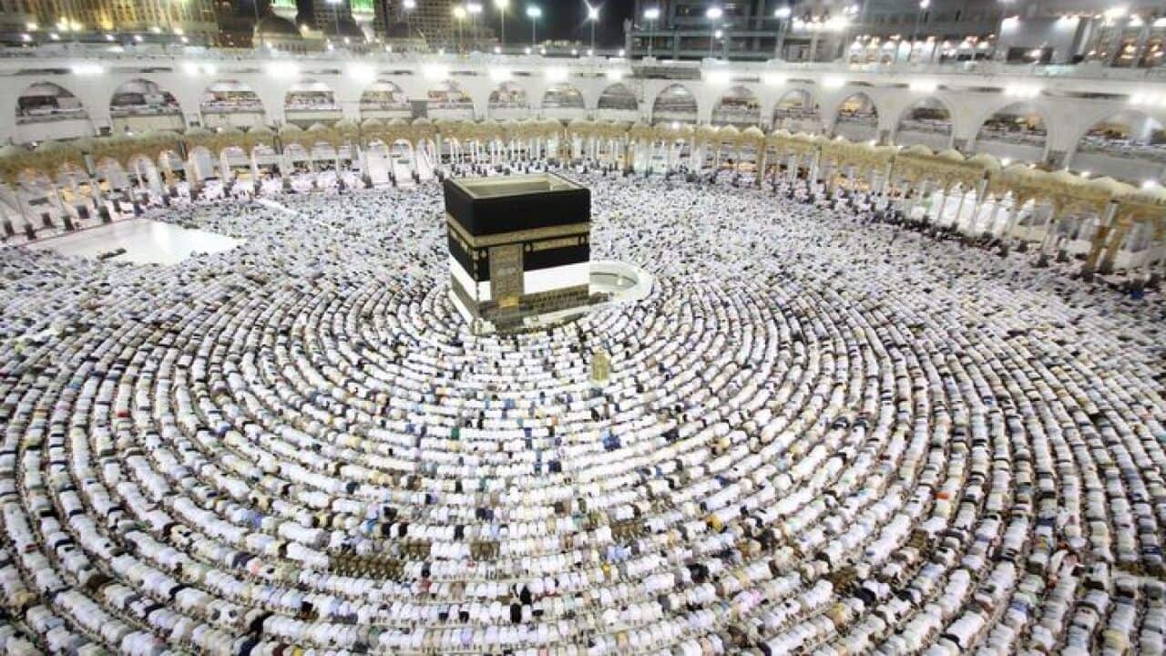 Muslim worshippers perform the evening prayers at the Kaaba, Islam's holiest shrine, at the Grand Mosque in Saudi Arabia's holy city of Mecca