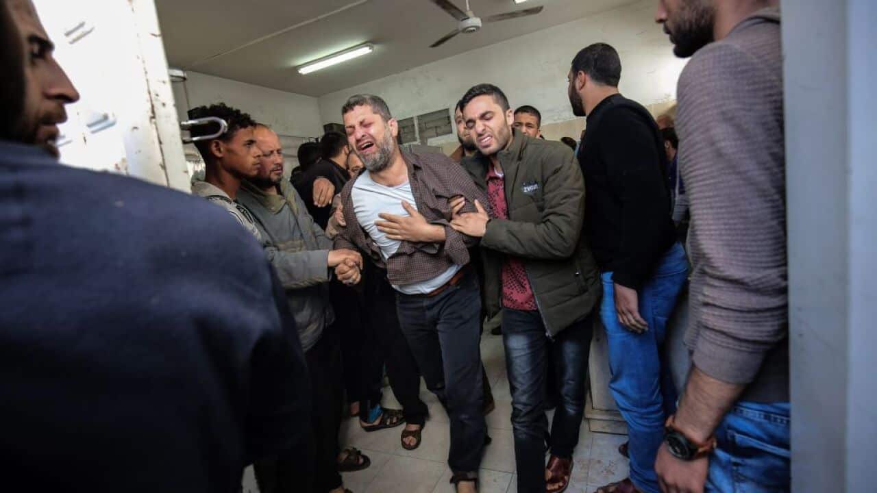Palestinian relatives of a man who died in an explosion east of Rafah in the southern Gaza Strip, mourn at the Najjar hospital in Rafah on April 14, 2018.