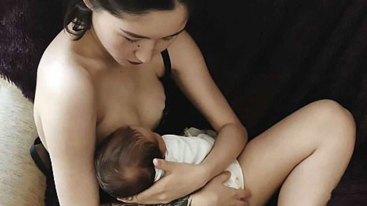 Aliya Shagieva breastfeeding her son