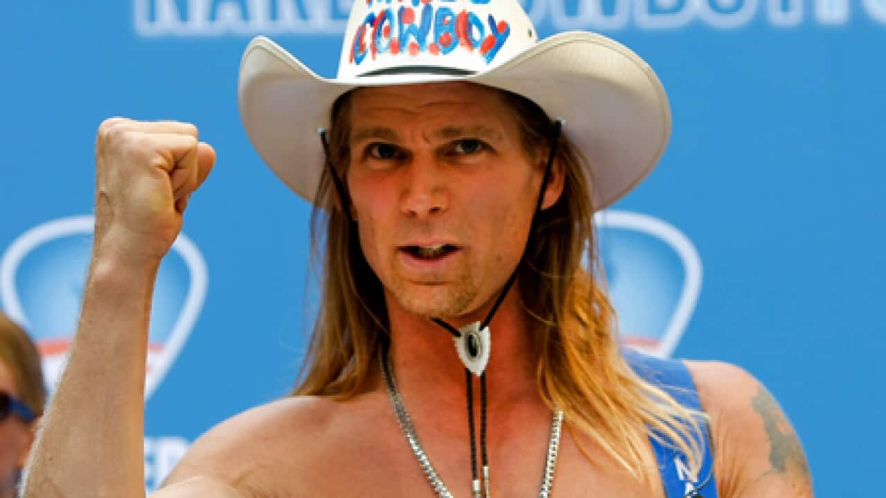 Naked_cowboy_close_101006_B_getty_893836400