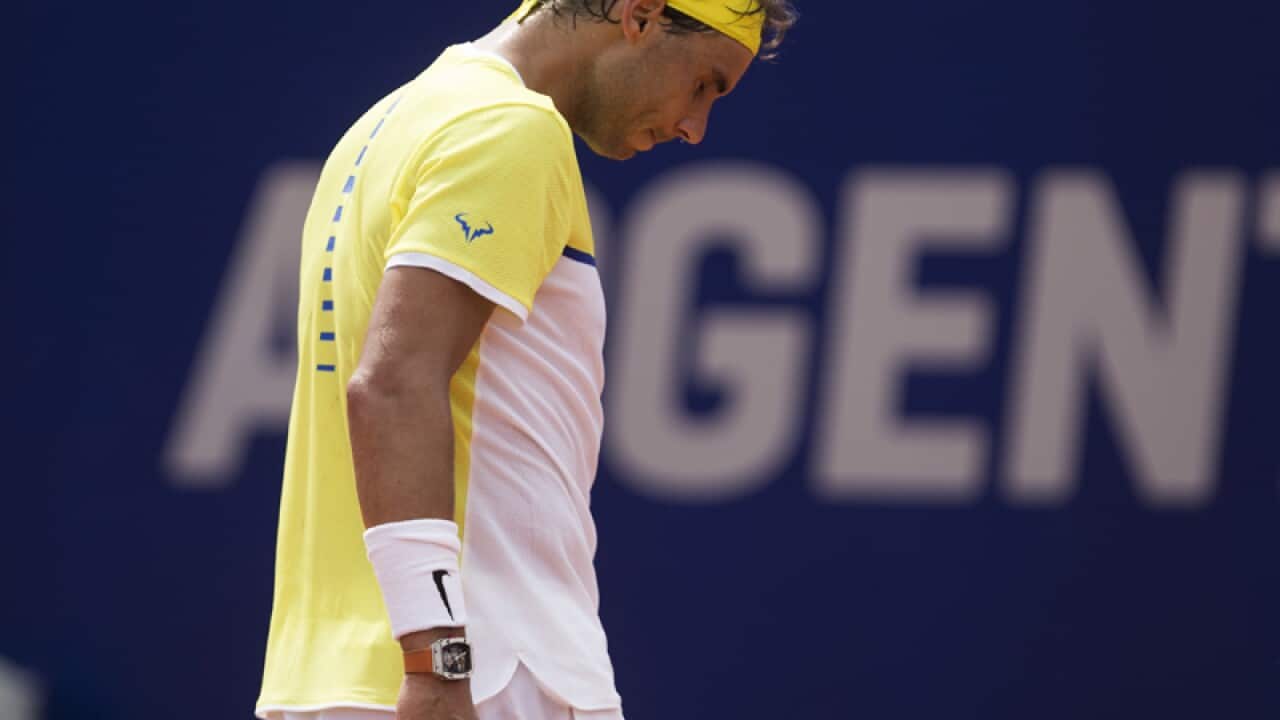 Rafael Nadal of Spain gestures during a match against Dominic Thiem