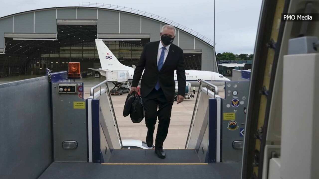 Scott Morrison boards the plane, bound for Europe