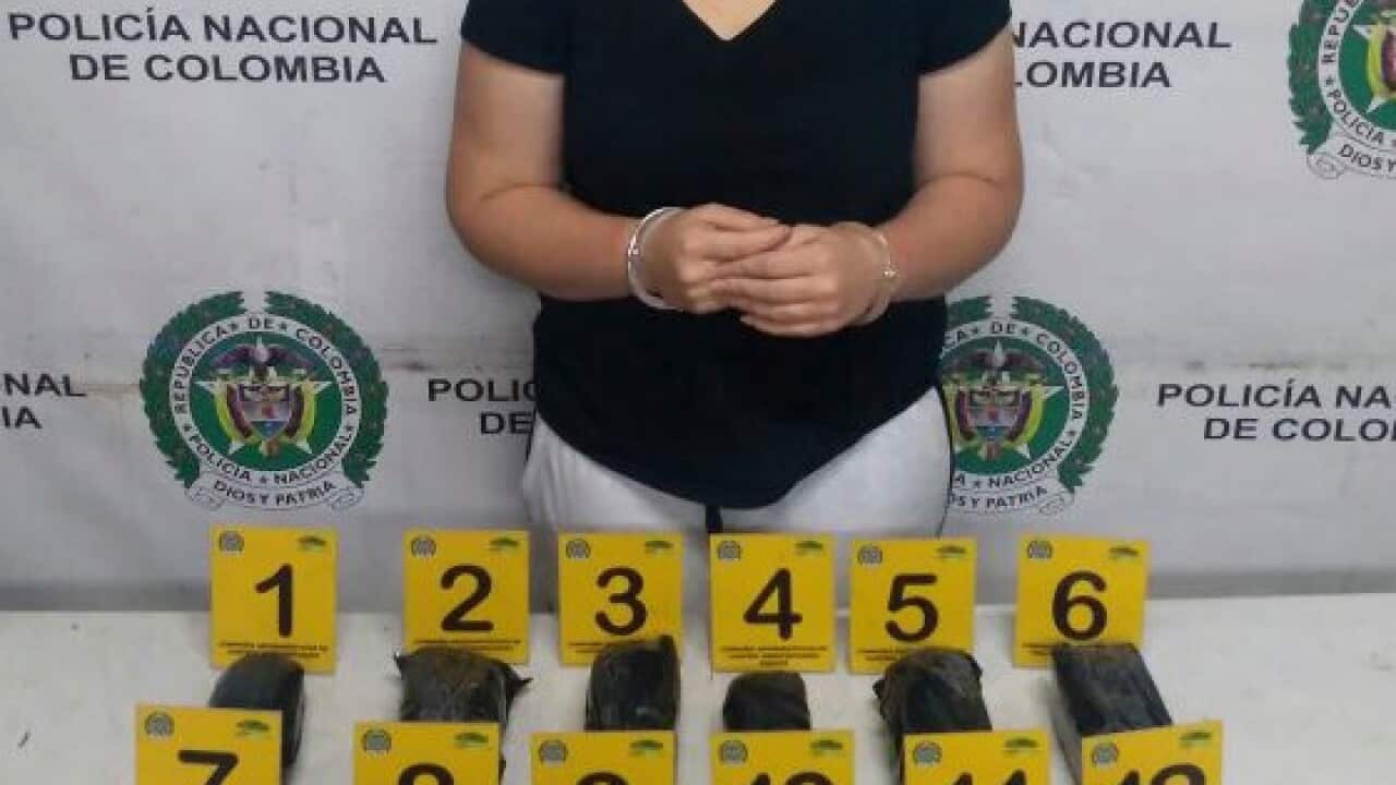 This April 12, 2017 photo released by Colombia's National Police press shows Australian Cassandra Sainsbury after she was arrested at Bogota Airport