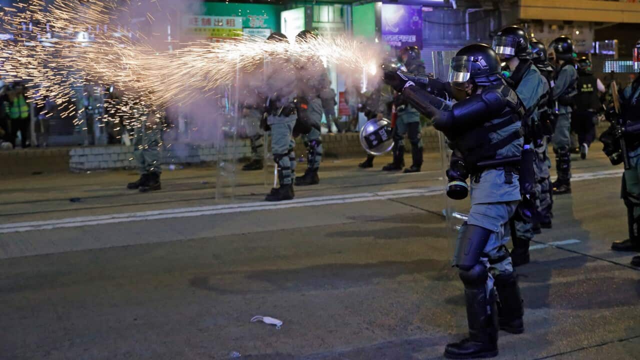 Policemen fire tear gas shells on protestors in Hong Kong