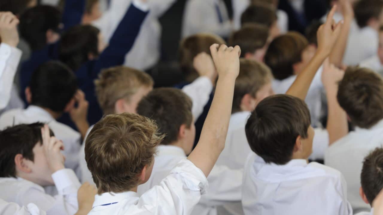 Students sit during a talk