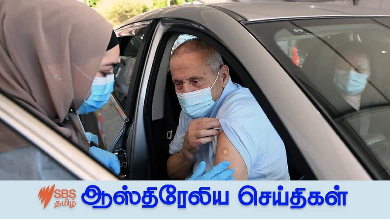 A man receives a COVID-19 vaccine at a pop-up drive through vaccination clinic at Belmore Oval, in Sydney, Friday, September 17, 2021.