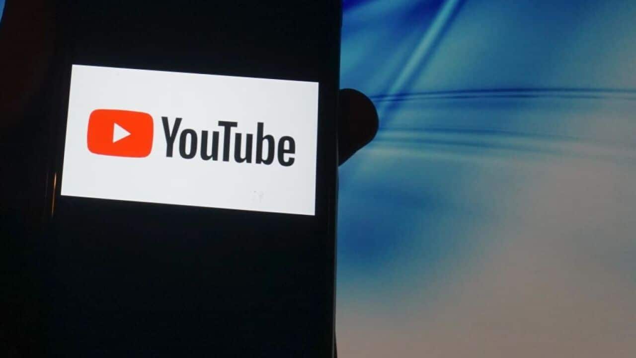A YouTube logo is seen displayed on a smartphone in London 14 November 2020.