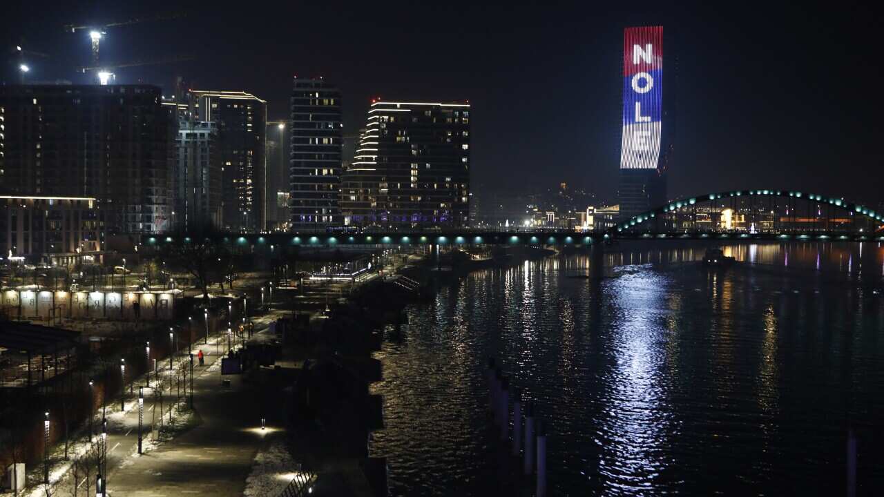 The word 'Nole', nickname of Serbian tennis player Novak Djokovic, and the colors of the Serbian flag are illuminated at the Belgrade Tower in Belgrade, Serbia, late 16 January 2022. Defending champion Novak Djokovic lost his court appeal agai