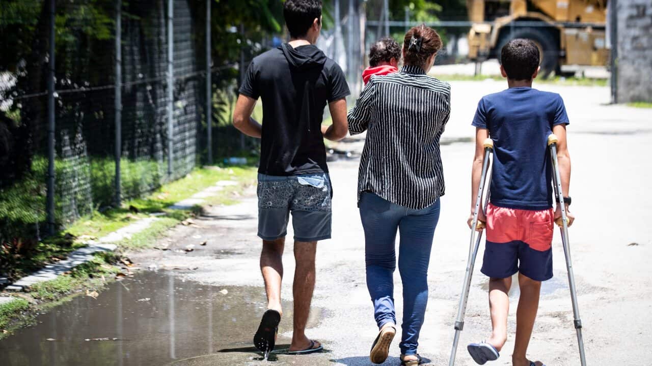Refugees Mohammad, 17, Aryana, 2 1/2 months old, his mother and little brother Amirparsa, 11, are pictured on Nauru.