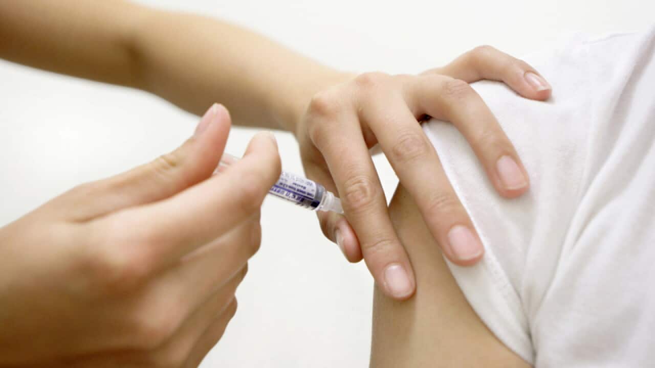 A doctor gives and injection
