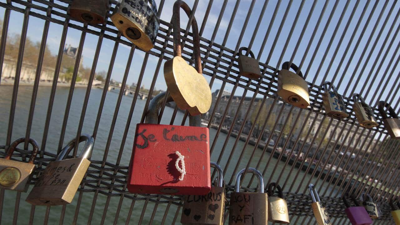 Locks attached by lovers are pictured on the railing of the Solferino bridge on April 1, 2012 in Paris. (AFP)