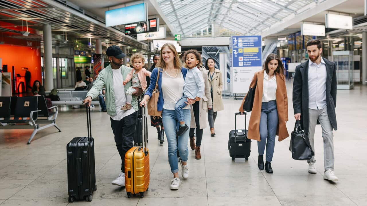 Family Make Their Way Through Airport